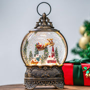 Christmas Village Snow Globe Lighted Flying Santa Scene, Musical Snow Water Lantern Swirling Glittering Home Decoration and Gift, Battery Operated or USB Powered